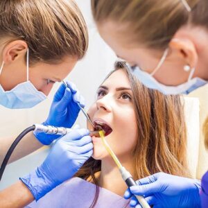 Dentist performing an oral exam